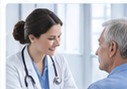 A clinician and patient in a primary care consultation